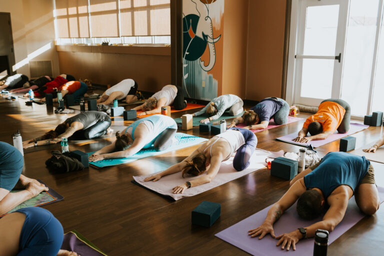 full yoga class with yoga practitioners