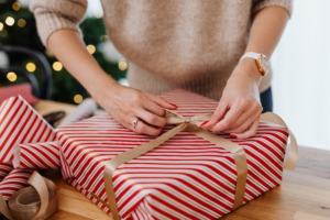 A woman wrapping a present